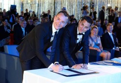 Vincent Autin (L) and Bruno Boileau smile as they sign a document during their marriage ceremony, France's first official gay marriage, at the city hall in Montpellier on May 29, 2013. France is the 14th country to legalise same-sex marriage, an issue that has also divided opinion in many other nations. The definitive vote in the French parliament came on April 23 when the law was passed legalising both homosexual marriages and adoptions by gay couples. AFP PHOTO / GERARD JULIEN